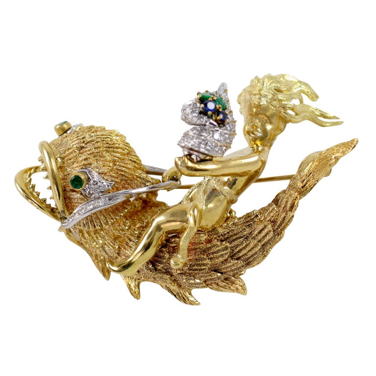 Golden Boy Riding on a Dolphin Brooch For Sale