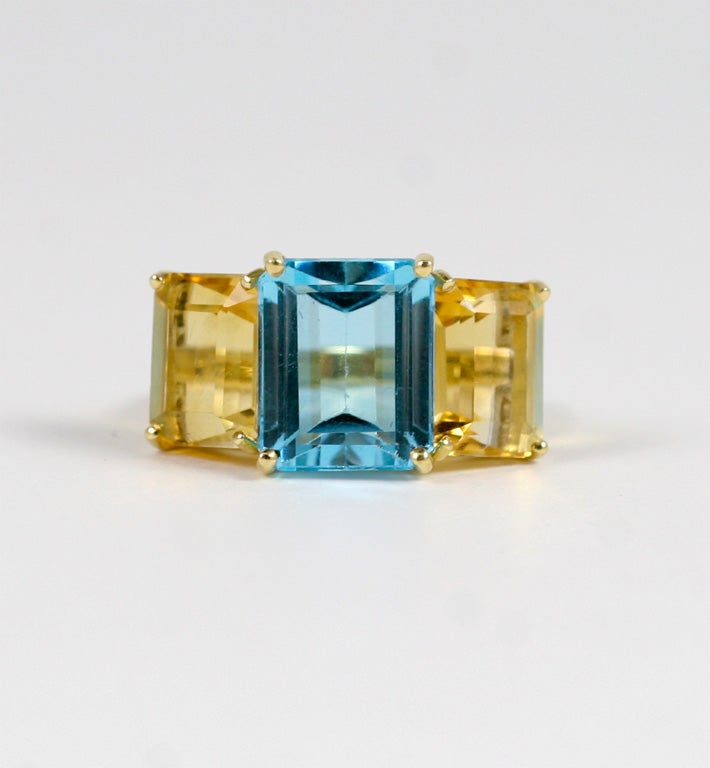 18kt yellow gold Emerald Cut ring with citrine (approximately 5 cts) and peridot (approximately 4 cts each).

The Ring measures approximately 1 