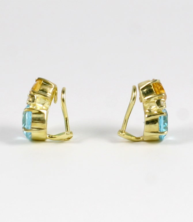Medium 18kt yellow gold GUM DROP™ earrings with citrine (approximately 2.5 cts each), blue topaz (approximately 5 cts each), and 4 diamonds weighing 0.40 cts.

Specifications: Height: 3/4