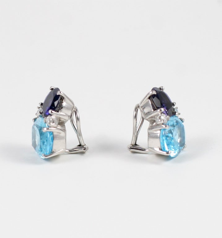 Large 18kt white gold GUM DROP™ earrings with iolite (approximately 5 cts each), blue topaz (approximately 12 cts each), and 4 diamonds weighing 0.60 cts.

Specifications: Height: 7/8