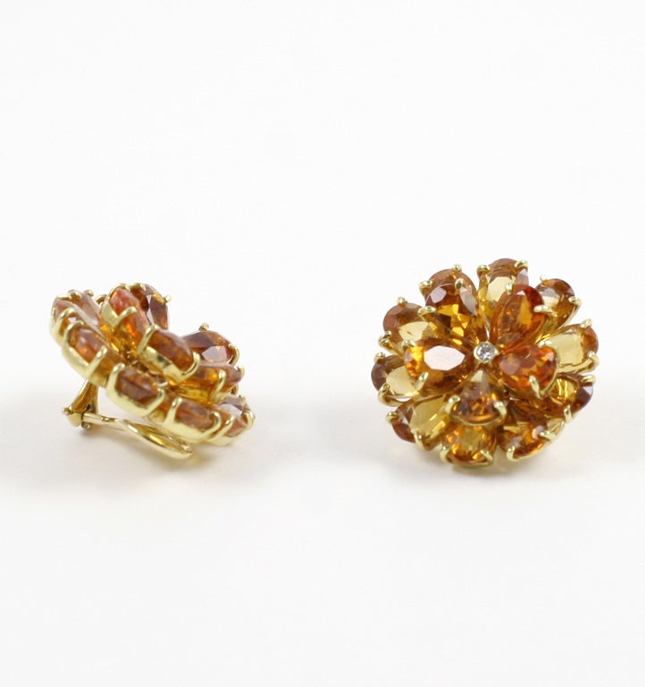 18kt Yellow Gold Citrine Double Tier Flower Earrings with diamond Center.

The pear shaped citrine and diamond earring measure 1