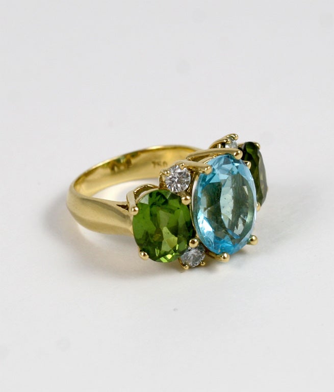 Contemporary Large 18kt Yellow Gold Gum Drop Ring with Blue Topaz and Peridot For Sale