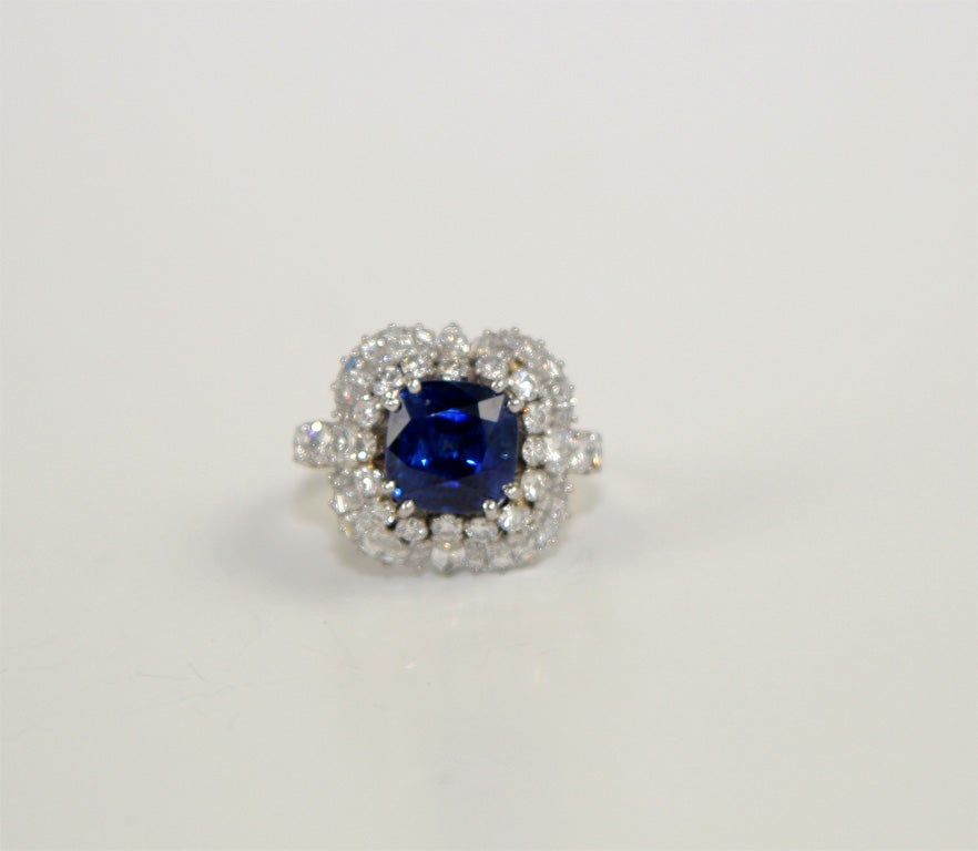 platinum baguette diamond, marquise diamond and round diamond cluster ring centering cushion shape sapphire 5.18 carats<br />
48 diamonds 3.00 carats