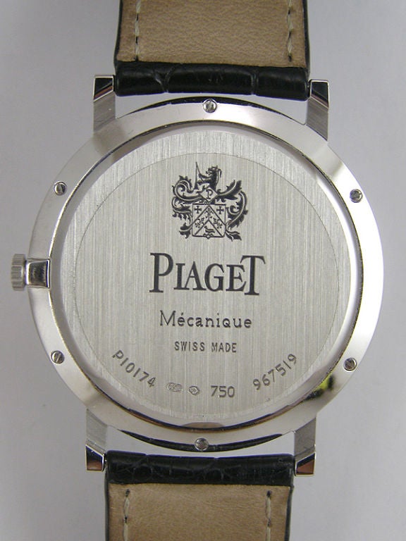 Piaget 18K WG Altiplano XL, ref #P10174, 38 mm diameter case circa recent production with matte white dial with thin printed black indexes and pointy dauphine silver hands. manual wind movement on signed black crocodile strap with 18K WG Piaget