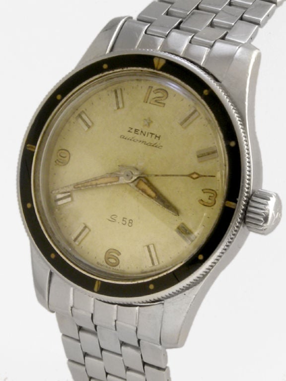 Zenith S-58 self winding diver's model circa 1959. 37 X 46mm diameter case with screw down back stamped in script S-58. Rotating elapsed time bakelite bezel. Original patina'd silver satin dial with applied silver indexes and luminous dauphine hands