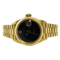 Rolex Ladies Gold Black Face Watch