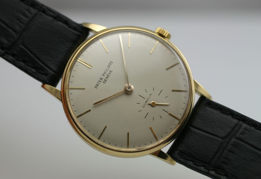 Patek, Philippe & Co. Calatrava Retailed by Gübelin in 18k yellow gold. Reference 3410, manual wind movement, 18-Jewels, caliber 27AM-400, anti-magnetic, seconds at 6 O'clock, silver dial with applied markers. Triple signed: dial, movement & case