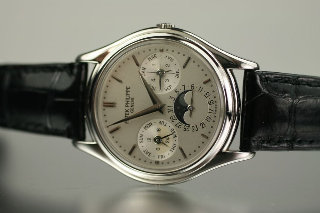 This is a Patek Philippe Perpetual Calendar 3940P platinum watch on a Patek Philippe strap & platinum buckle. The functions are day, date, month, moon phase & perpetual calendar with an automatic Patek Philippe Caliber 240 Q, 27-Jewels. Comes with