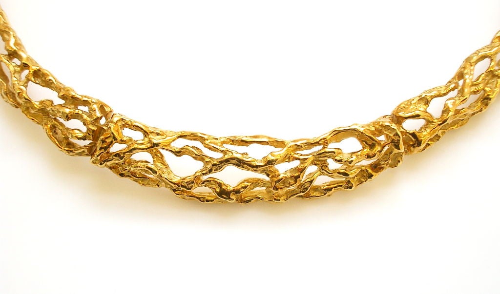 A handsome 18k yellow gold necklace by Arthur King. The free-formed gold choker measuring 16