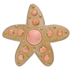 A wood and coral starfish brooch by Seaman Schepps