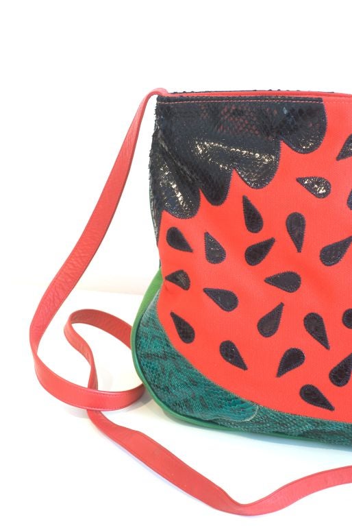 How many watermelon python bags do you have in your closet?  Nary a one we would imagine which we are certain is exactly what Carlos Falchi must have been thinking when he designed this whimsical bag.  Great fun for toting things to the beach and