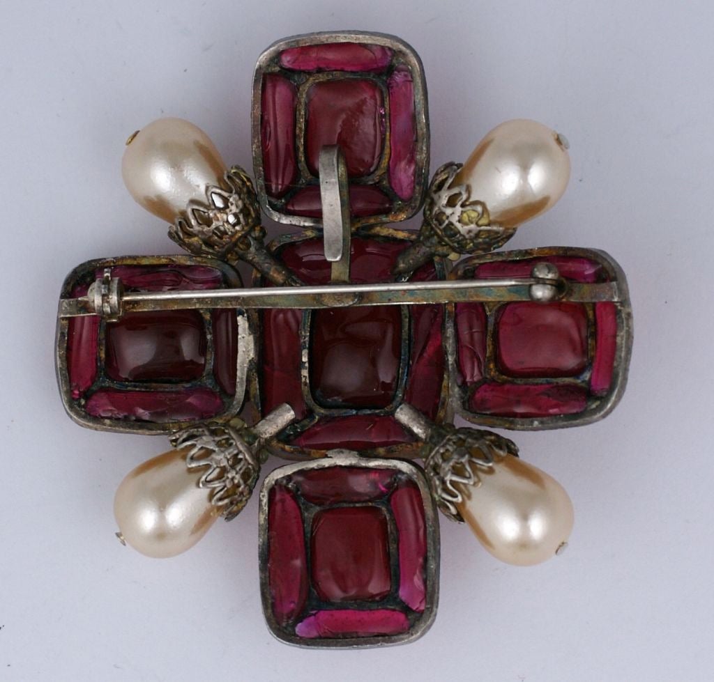 Chanel Ruby poured glass brooch/pendant circa 1980s. Hand hammered antique silver metal with pear shaped faux pearls.<br />
Hook on back for pendant chain. Excellent condition.<br />
Signed 