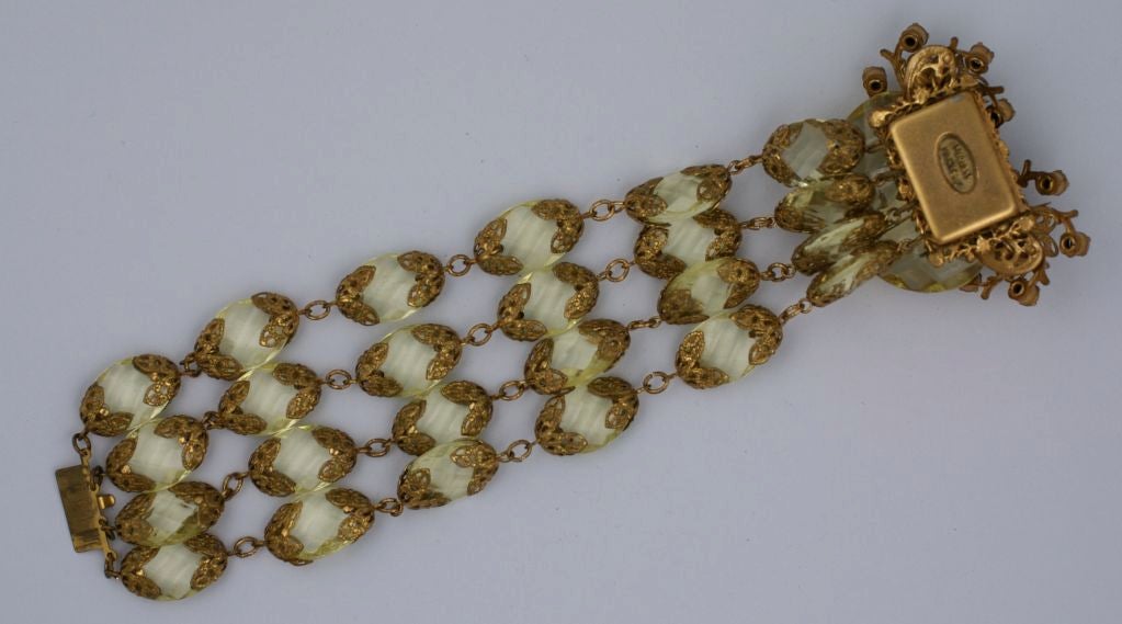 Important Miriam Haskell 4 strand facetted faux citrine and gilt filigree bracelet. Gilt filigree caps in signature Haskell "Russian Gold" finish bookend each "stone" and the large clasp is formed from faux citrine pastes and