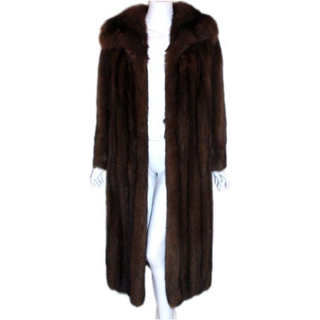 This is a sumptuous natural brown sable fur coat, by Revillon for Saks Fifth-Avenue. This coat has a large collar, two front slit pockets, an open front, and a 100% silk lining.
It is lovely and light and perfect for travel.

