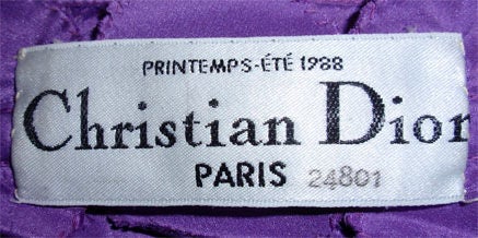 Christian Dior Haute Couture, Circa 1988. 
Fabric is crinkled silk chiffon, with a fitted bustier, flower, and a long shoulder wrap.
Provenance:  Betsy Bloomingdale

Please note the NO RETURNS POLICY: 
All sales are final, so please do be be sure to