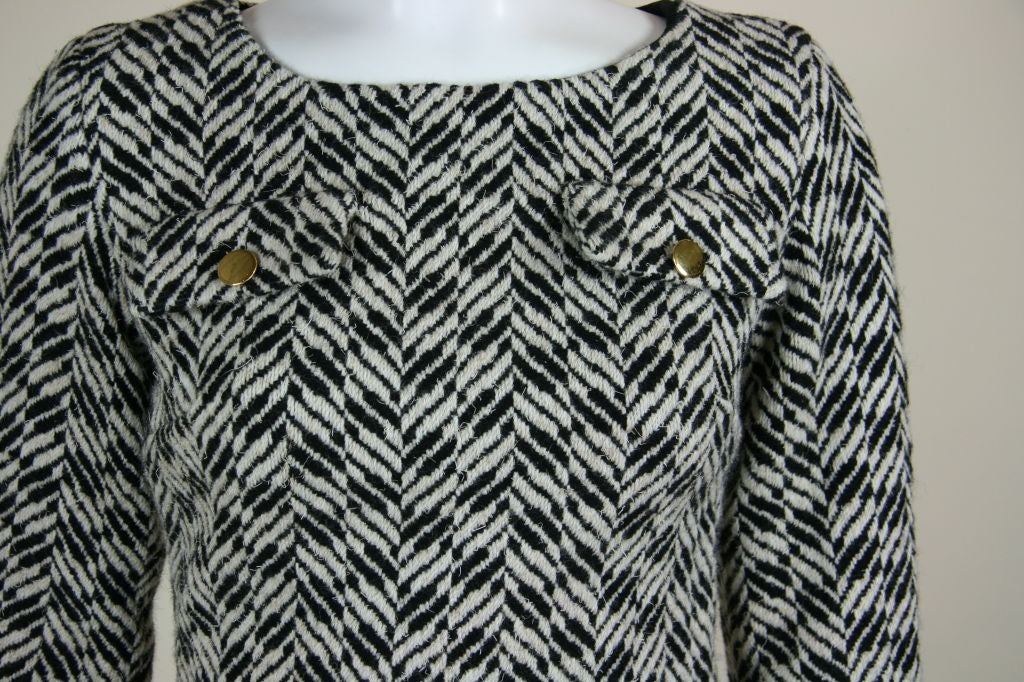 Mary Quant wool scoop neck dress. Knee length with side slits. Full length sleeves. Brass buttons on two faux front pockets, two brass buttons, cuff link style on the sleeves at wrists, and two buttons on each side of the hips at the top of slits.