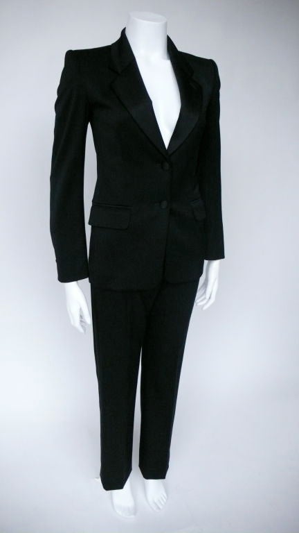 Iconic, classic Le Smoking Suit. Tapered Tuxedo striped pant.<br />
<br />
Y.S.L.  1936 -2008<br />
Yves Saint Laurent was the most prolific designer of his time. Starting his career at the house of Dior after Christian’s death in 1957 Yves rose