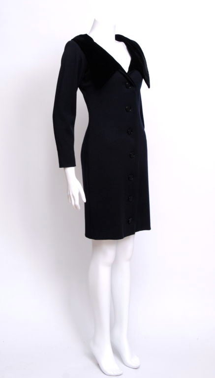 80's black wool jersey tuxedo dress, trimmed in velvet,with a front or back V neckline and buttons all the way down. Fully lined