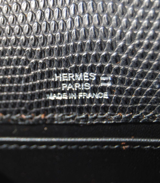 Hermes Kelly Pochette Matte Black Lizard with Palladium Hardware J Stamp<br />
<br />
The pochette measures 21.5 cm/ 8.5
