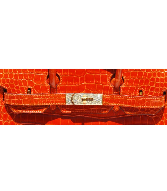 Glamorous!!!<br />
Pre-Owned<br />
<br />
30cm Birkin Orange Crocodile with Gold Hardware | E Stamp<br />
<br />
The bag measures 30 cm/ 12