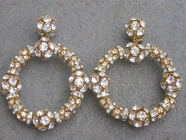 These Giant hoops were from Christian Lacroix 's famous pouf collection for the house of Patou , in 1986.<br />
<br />
They were purchased with a few pouf dresses from Patou, in Paris. Made with genuine Swarovski Austrian crystals and comfortable