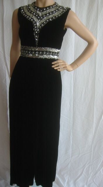 Gorgeous Vintage Jeweled Jumpsuit from Ceil Chapman<br />
<br />
This lovely jumpsuit is made of soft black velvet. Made with a beautiful fit, the jumpsuit is beautifully embellished with silver sequins, seed beads and genuine Swarovski Austrian