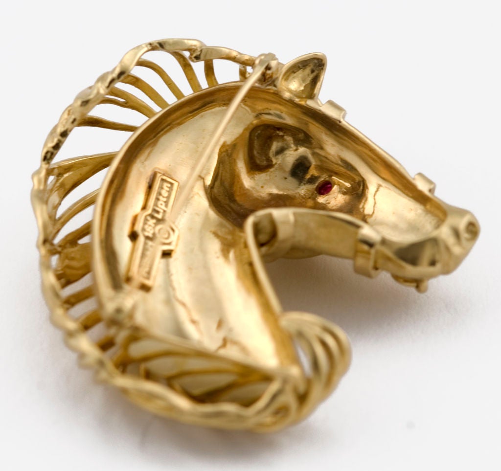 PLEASE VISIT LAUREN STANLEY IN NEW YORK<br />
<br />
A magnificent 18 karat gold and ruby brooch - pin - one-of-2-made - by Albert Lipten, in the form of a horse's head sporting an elegant 3-dimensional mane and a bridle around the horse's mouth,