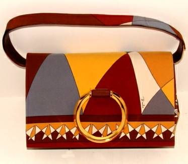 Gusseted silk purse with detachable carry strap which can be worn over arm, shoulder or as a clutch.
