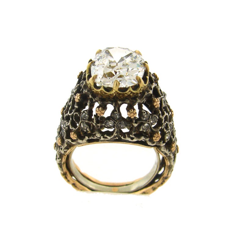 Intricate design of this ring was inspired by floral motif. The craftsmanship is extremely fine; all the details are meticulously worked out.<br />
The ring is made of 18k yellow, white and rose gold and set with rose cut diamonds and 3.64 cts