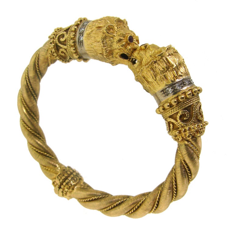 Fabulous bangle with two chimera heads facing each other created by Ilias Lalaounis in circa 1970's. Intricate design with meticulously worked out details<br />
Fits a wrist up to 6