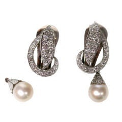 Glamorous diamond 
platinum clip earrings with a pearl drop