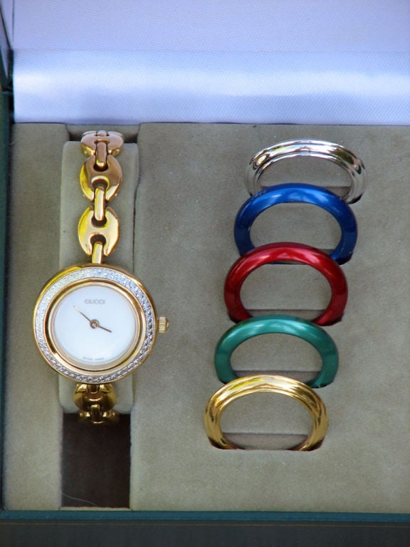 Fine vintage Gucci 'Marine link' bracelet watch with 6 assorted bezels. Quartz movement item complete with original Gucci box & booklets.