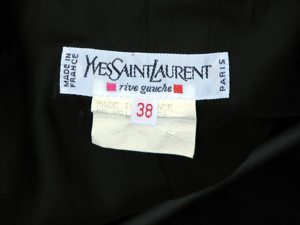 Fine vintage Yves Saint Laurent 'Equestrian' jacket. Authentic 1980s Rive Gauche item made in France. Item labeled size 38 & appears to fit a modern US size 8-10. Fine 'emerald' green wool item with black velvet trim. Item fully silk lined with gilt