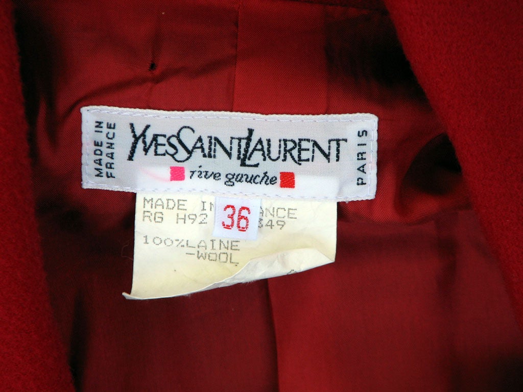 Fine vintage Yves Saint Laurent Rive Gauche fitted jacket. Authentic 1980s item made in France. Fine red wool fabric item fully silk lined with gilt enamel metal button front closures. Item labeled size 38 & appears to fit a modern US size 8-10.