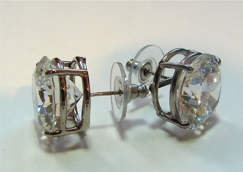 We tend not to be demure- from our cubic zirconia stud collection, these simple ten carat white diamond weight size CZ studs are perfect and pure. Large celluloid push backs keep them snug against the earlobe.