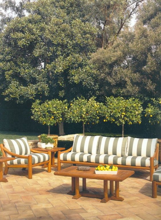 Michael Taylor Design Outdoor Douglas Teak Collection. This collection was inspired by his interior oak lounge series.  The Douglas Collection is comprised of large, substantial pieces of oiled teak. Included is a sofa, lounge chair, sun chaise,
