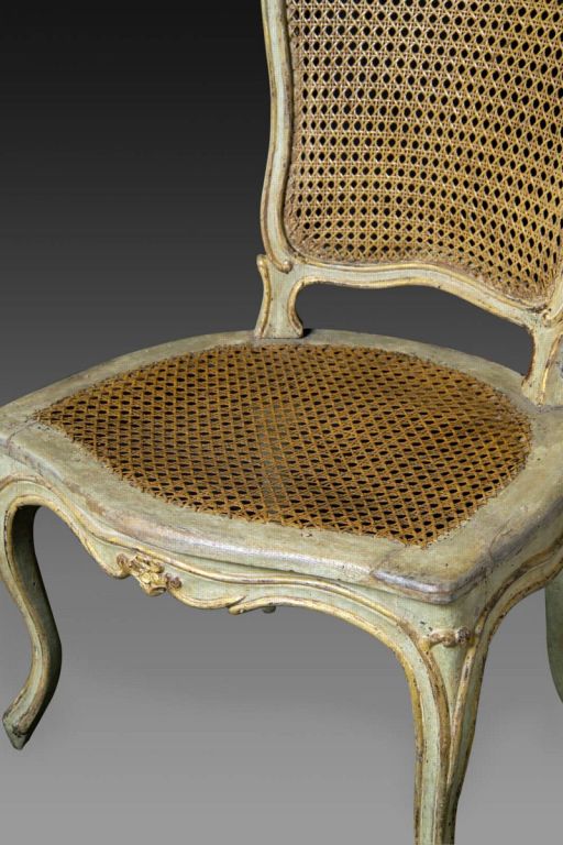 A set of four elegant French Louis XV, carved and painted, beechwood side chairs attributed to Etienne Michard.  A stamp is very faint on one of the chairs. The caning is thought to be original.  <br />
<br />
Claude-Etienne Michard (1723-1794),