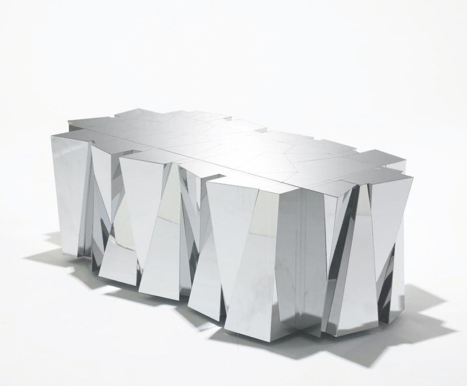 Paul Evans Studio for Directional, faceted coffee table,
USA, c. 1970. Stainless steel with glass table top.