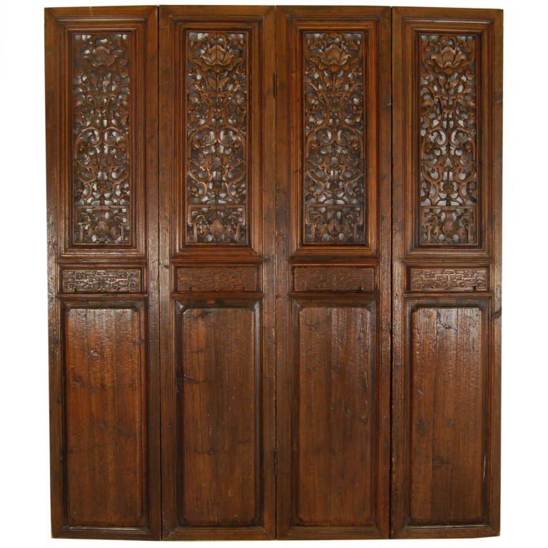 A set of four 19th centrury Chinese elmwood lattice doors carved with crooked dragons and bats, hinged to create a folding screen.<br />
<br />
Pagoda Red Collection #:  GDI021<br />
<br />
<br />
Keywords:  Panel, screen, folding, room divider