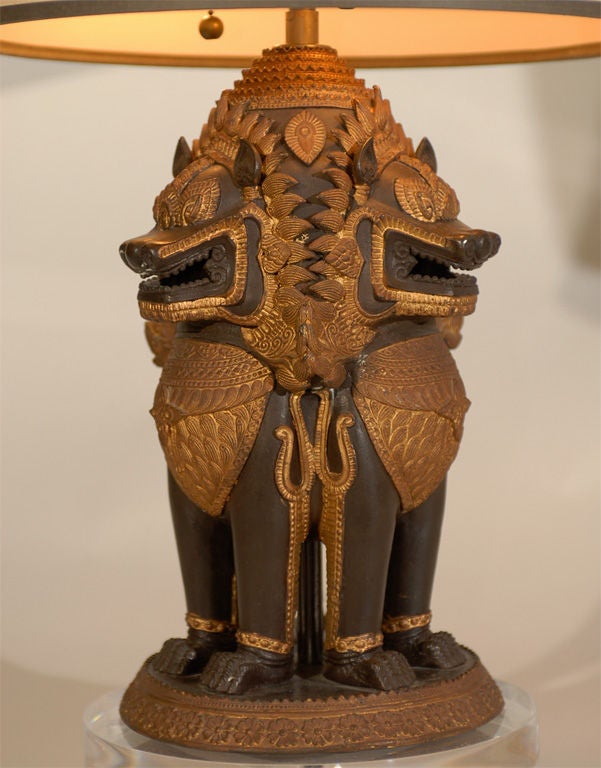 SOLD AS A PAIR<br />
+ Three Foo Dogs in one!<br />
+ Asian / ethnic feeling that will mix with endless looks<br />
+ Highly detailed with intricate carving and relief work<br />
+ Chocolate brown dogs are adorned with burnished gilt