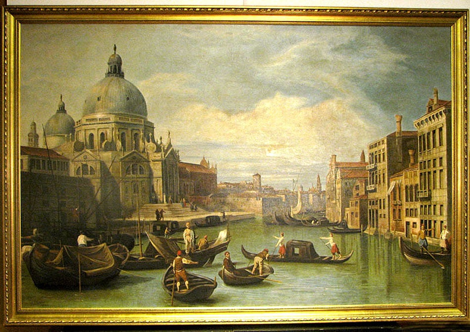 A VENETIAN SCHOOL PAINTING DEPICTING A SCENE ON THE GRAND CANAL, FEATURING THE BASILICA OF SANTA MARIA DELLA SALUTE AND SIGNED 