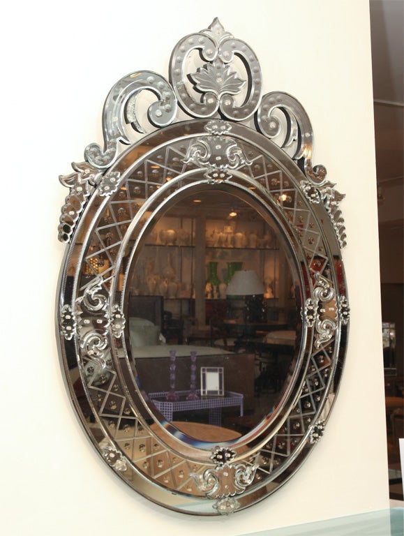 Oval Venetian mirror with crown.