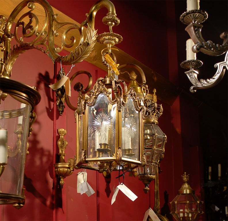 A fine gilt bronze lantern featuring six glass panels with handcut starburst ornamentation. 3 lights.