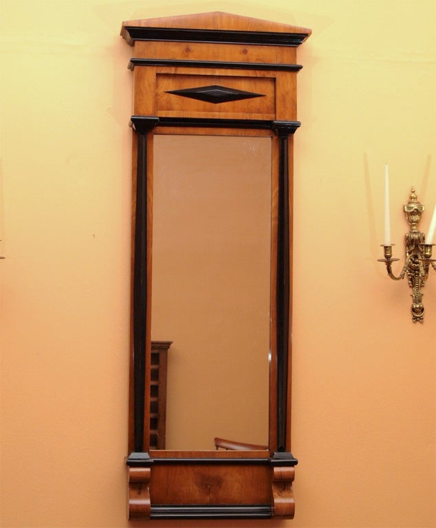Antique Biedermeier cherrywood pier mirror. Ebonised.