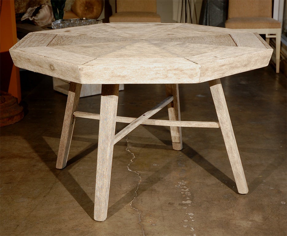Charming 1940s octagon-shaped pine game table with new driftwood finish. The tops of each wedge have removable tops which reveal a compartment (cubby).