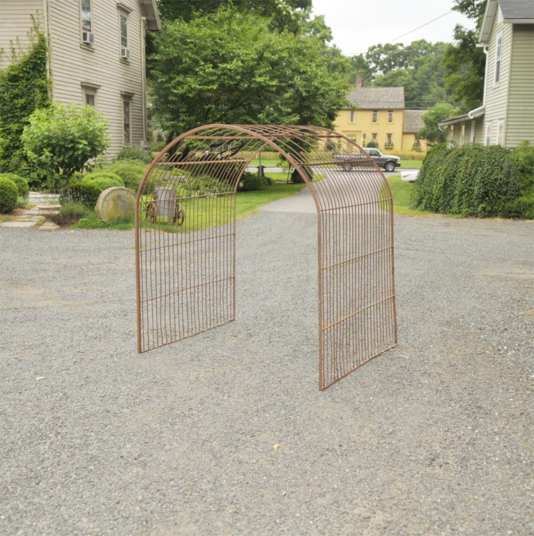 What a rare find--a pair of 4 ft deep wrought iron rose arbors that can be connected front to back to form a tunnel eight feet deep.  In near-perfect condition, the arbors presently have a lovely rusted surface, but can easily be sandblasted and