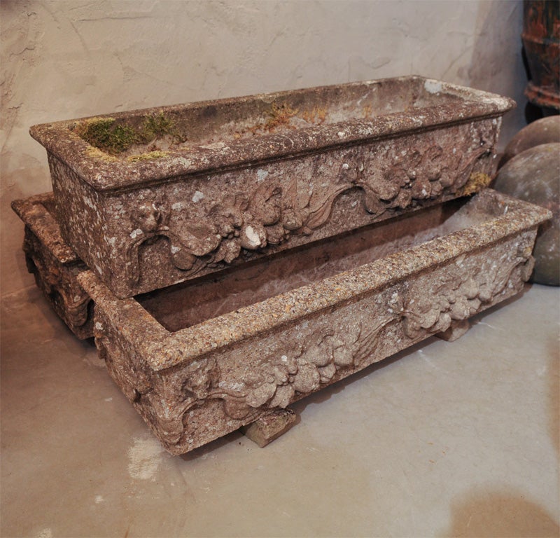 These palnters have it all--heavy lichen, mossy edges, perfect condition and architecturally-commanding fruit and flower swag decoration.  Three planters have applied swags to all four sides and three have it only to the front side.  Each planter