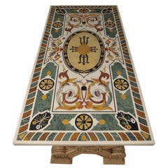 PIETRA DURA TABLE TOP AND CARVED MARBLE BASES , SOLD SEPARATELY