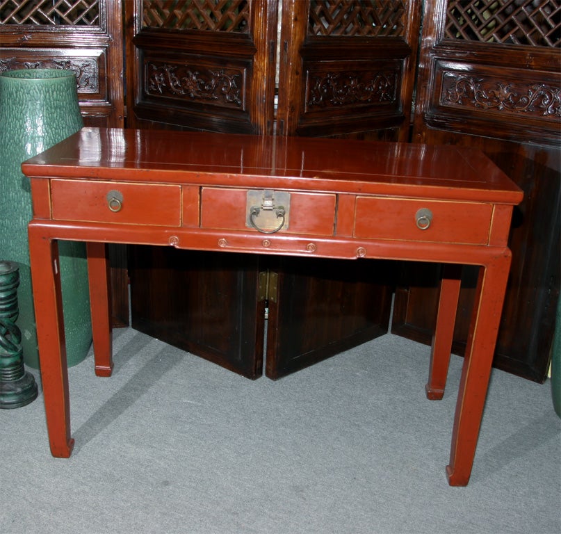 Chinese 19th century red lacquer desk table with drawers