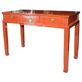 Chinese 19th century red lacquer desk table with drawers